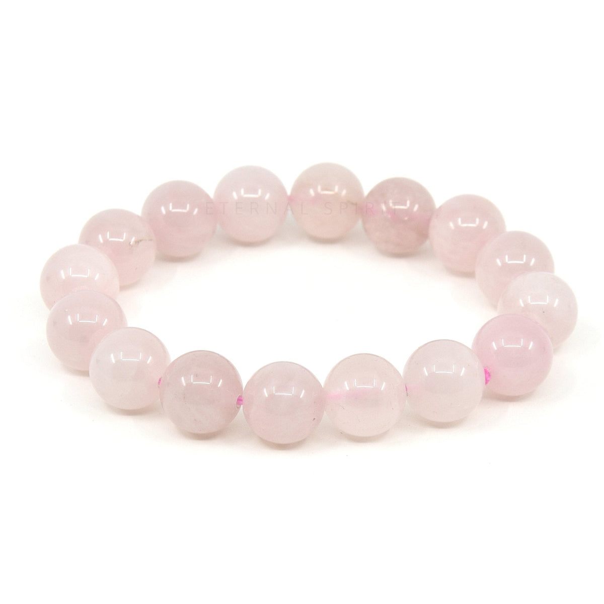 polished Quartz (Rose) 12mm round bead bracelet on white background — Eternal Spirit