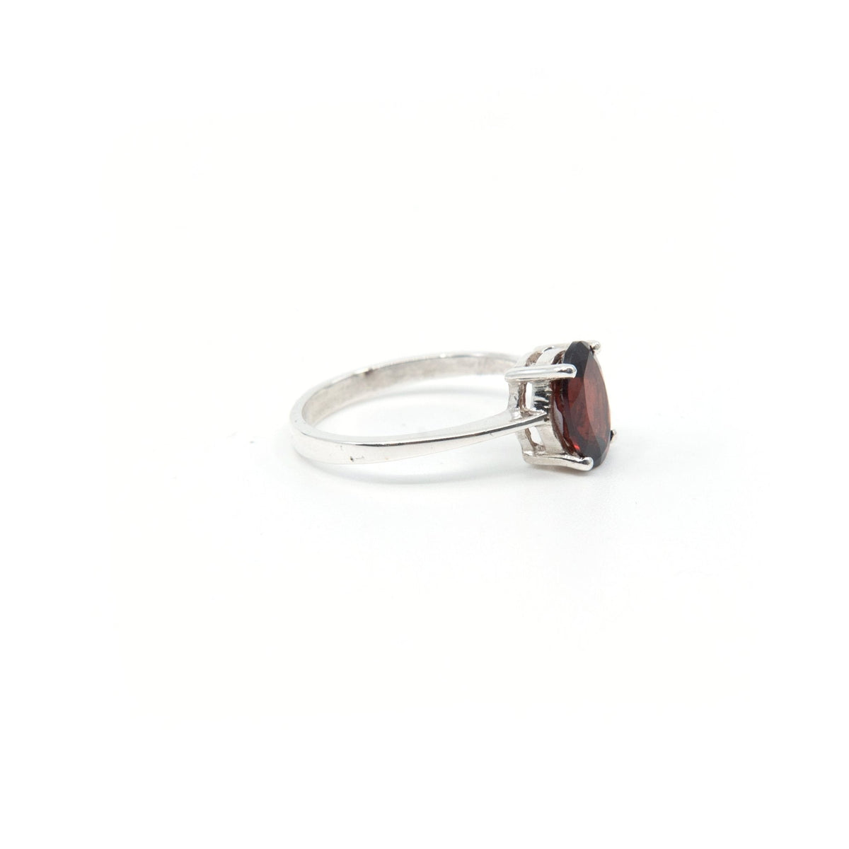 Garnet ring #R199 angled to reveal its polished setting and silver band — Eternal Spirit