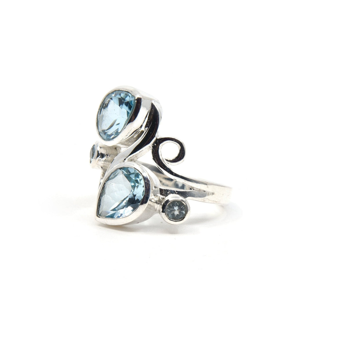 elegant side profile of Topaz (Blue) ring #R505, the gemstone catching light — Eternal Spirit