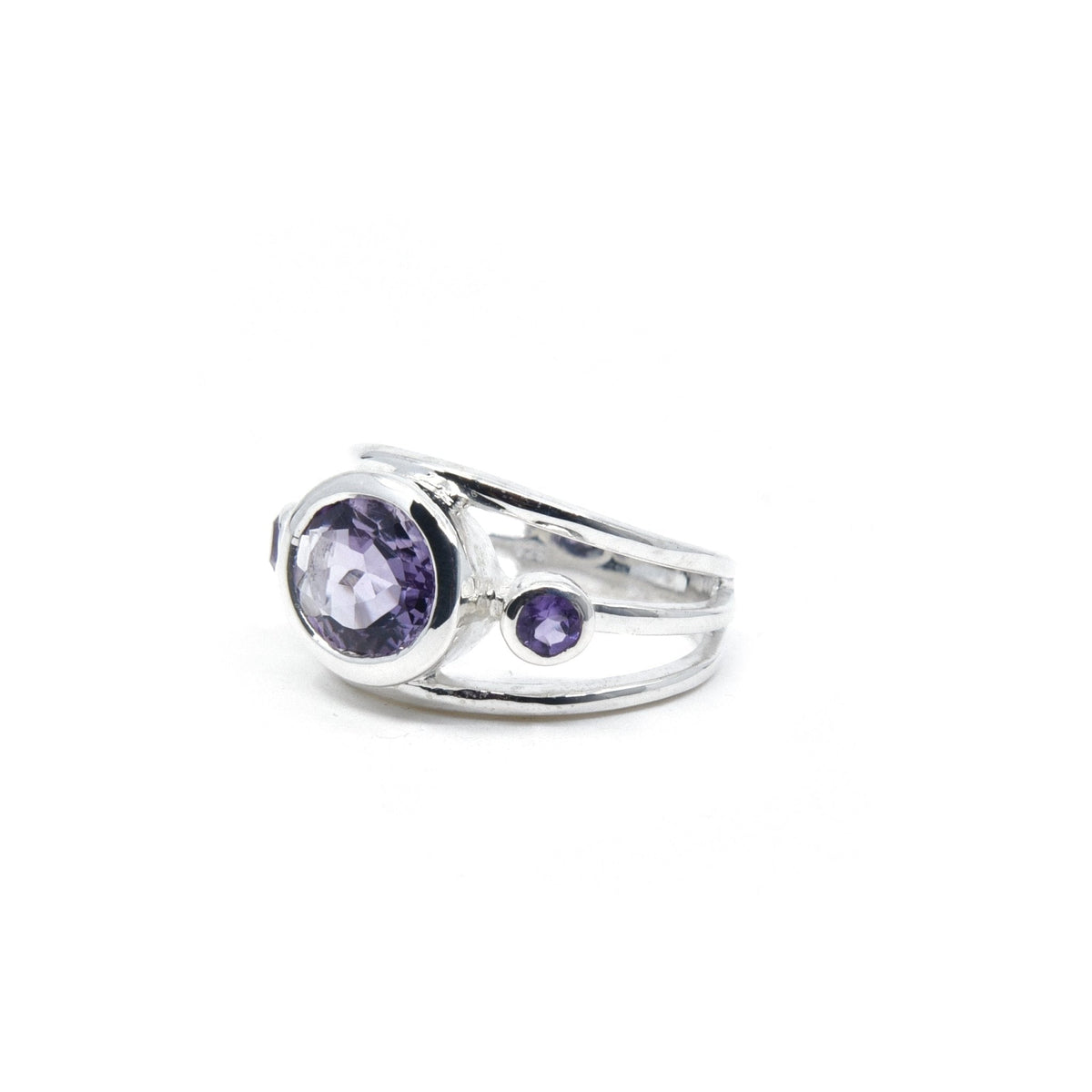 Amethyst ring #R549 angled to reveal its polished setting and silver band — Eternal Spirit