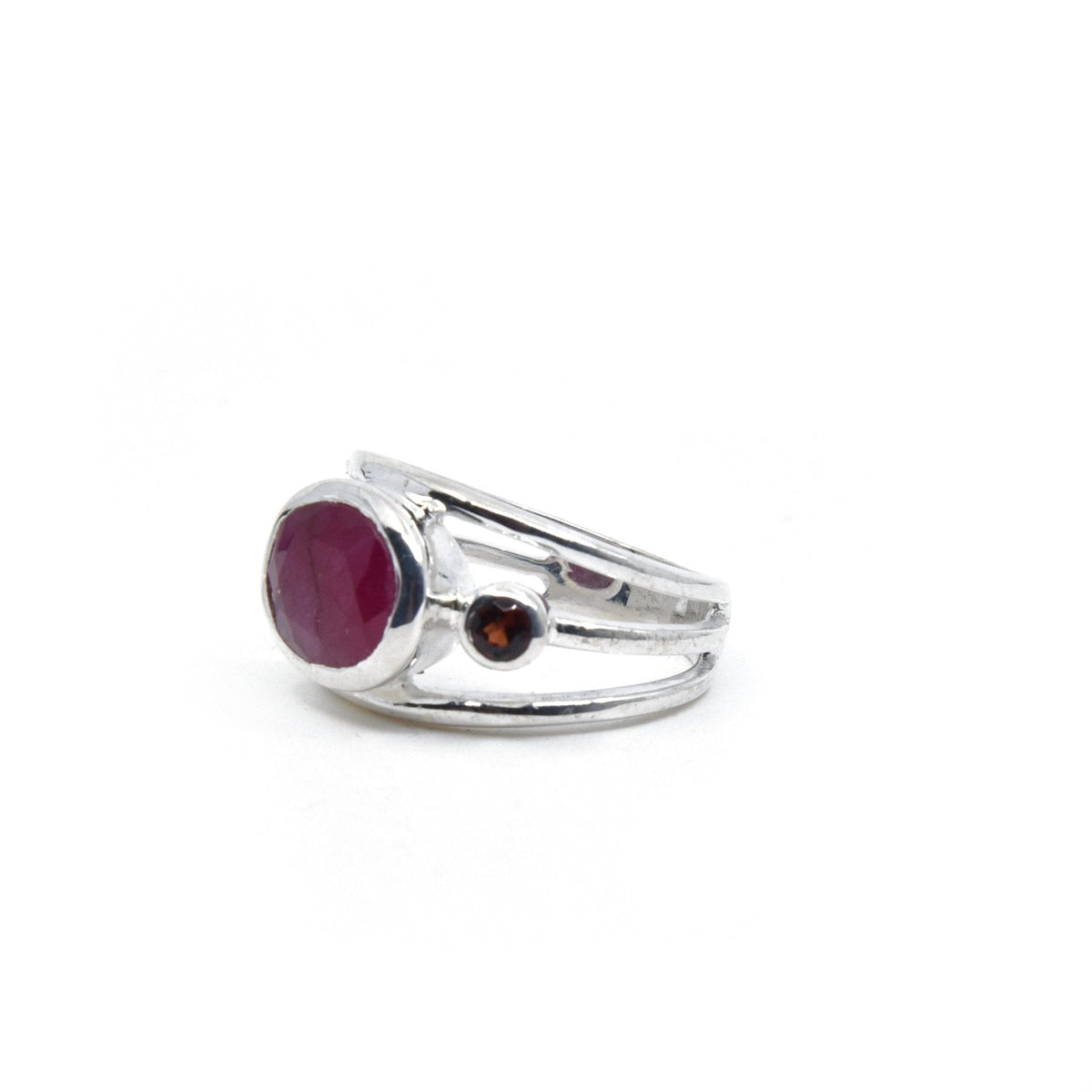 Ruby ring #R551 angled to reveal its polished setting and silver band — Eternal Spirit