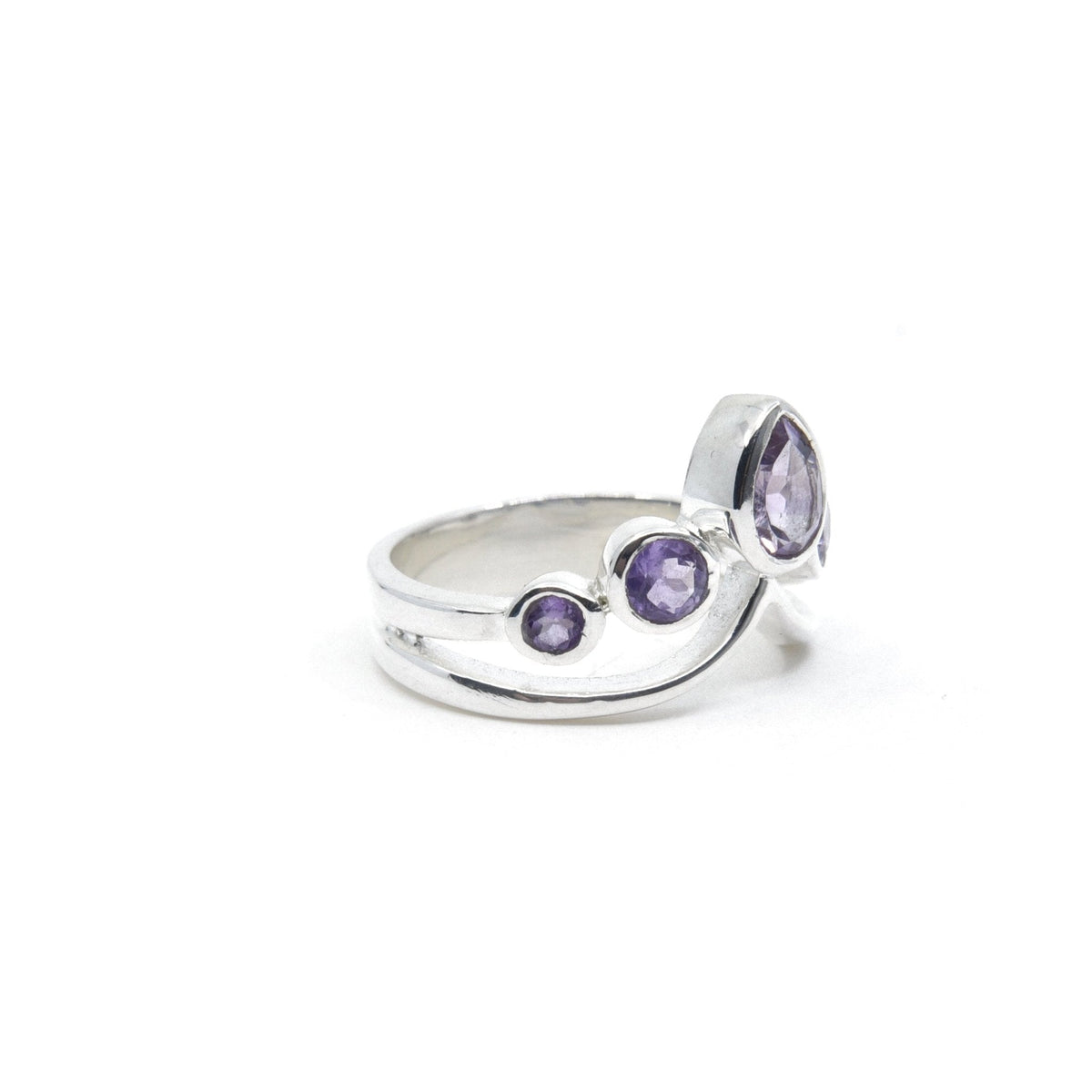 Amethyst ring #R559 angled to reveal its polished setting and silver band — Eternal Spirit
