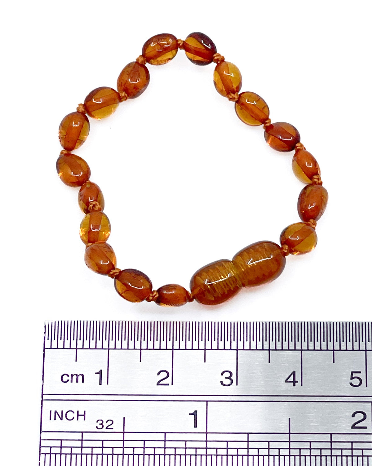 Amber teething bracelet, polished bead detail close-up — Eternal Spirit