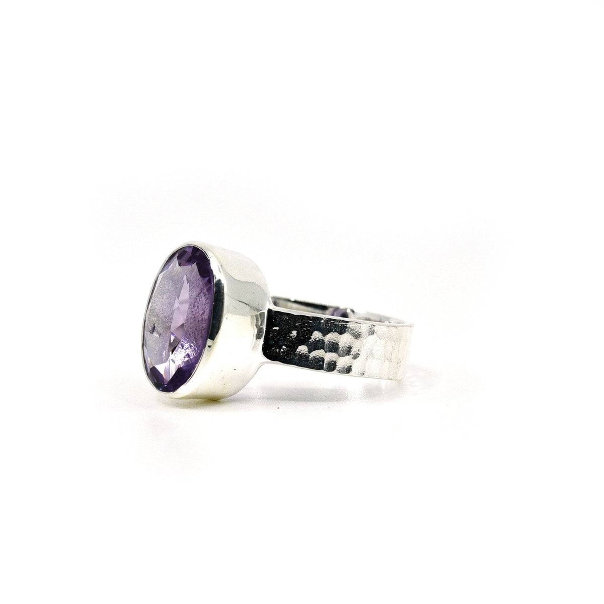 Amethyst ring #R699 angled to reveal its polished setting and silver band — Eternal Spirit