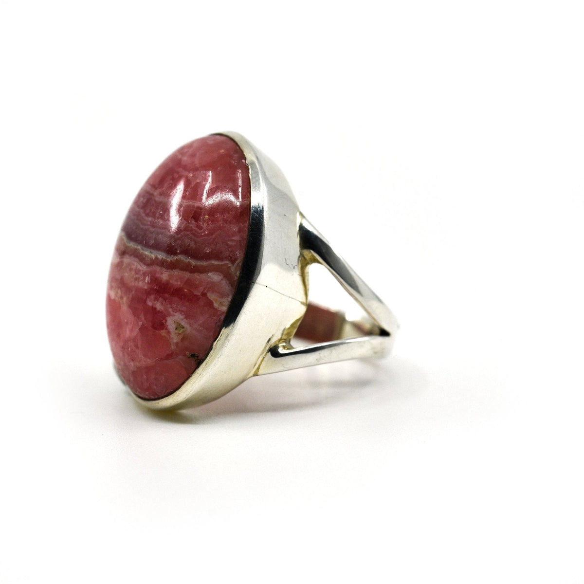 Rhodocrosite ring #R725 angled to reveal its polished setting and silver band — Eternal Spirit