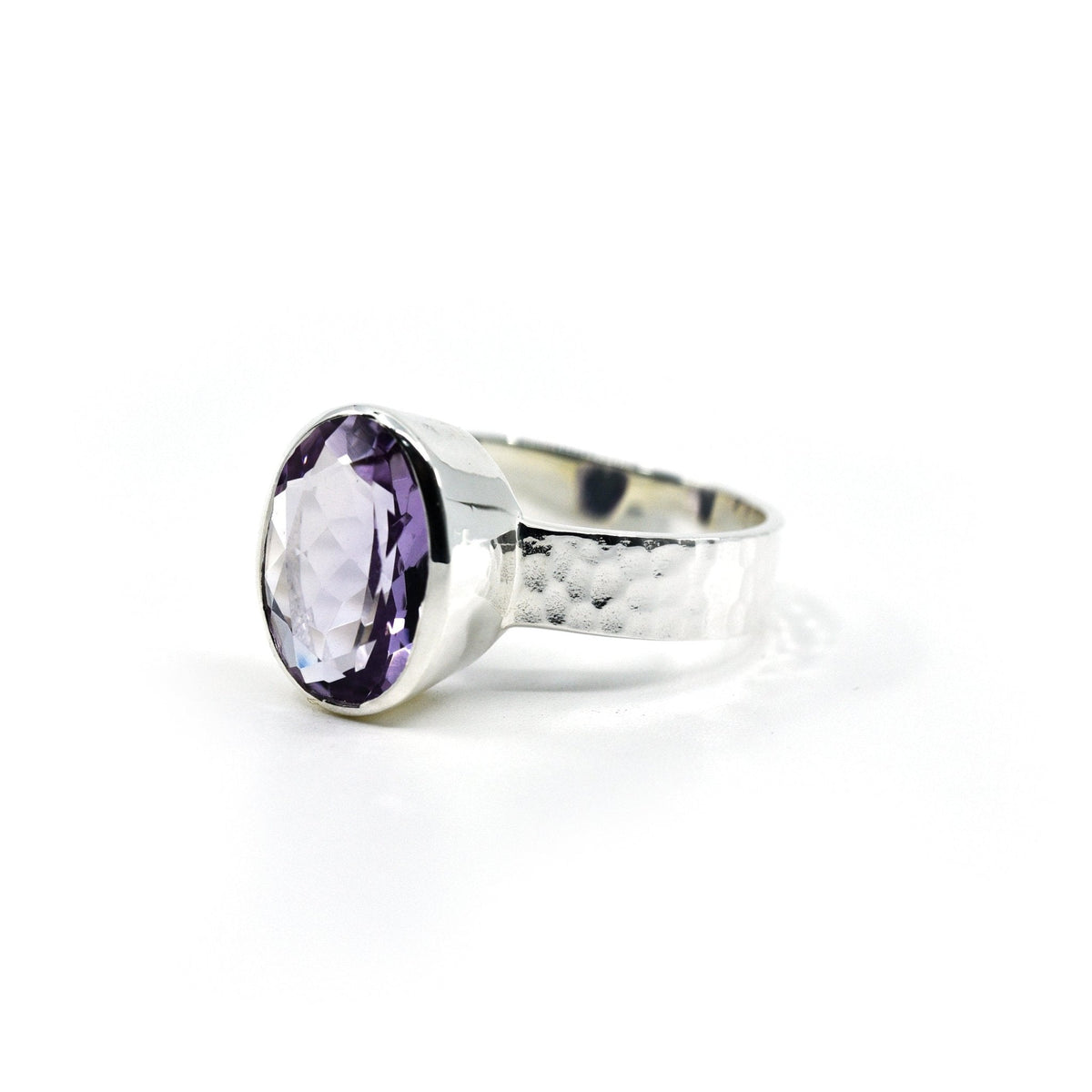 Amethyst ring #R740 angled to reveal its polished setting and silver band — Eternal Spirit