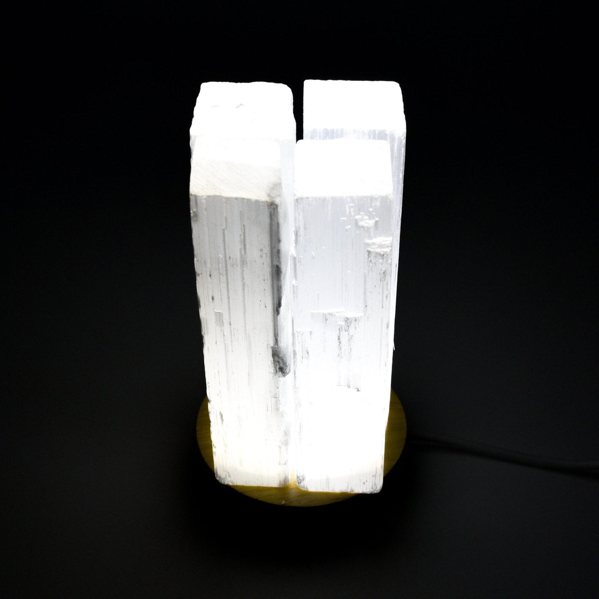 LED stand illuminating crystal from below, rainbow glow — Eternal Spirit