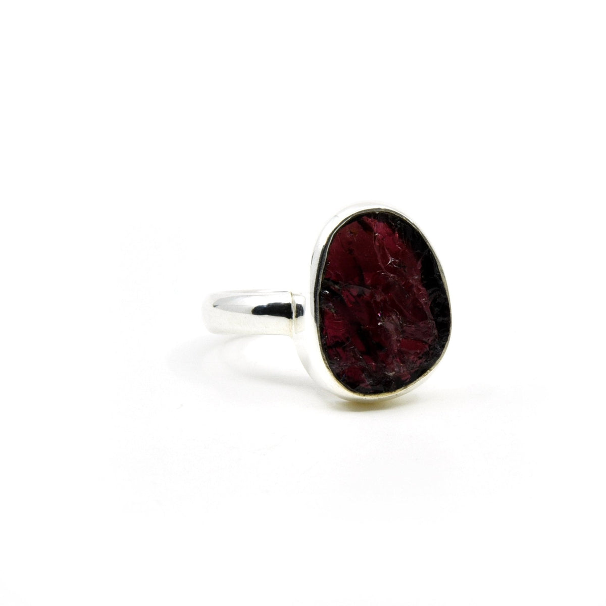 Garnet ring #R647 angled to reveal its polished setting and silver band — Eternal Spirit