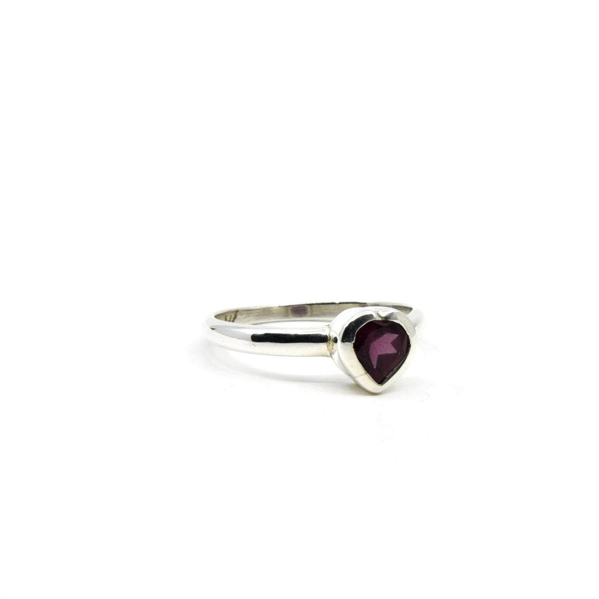 Garnet ring #R648 angled to reveal its polished setting and silver band — Eternal Spirit