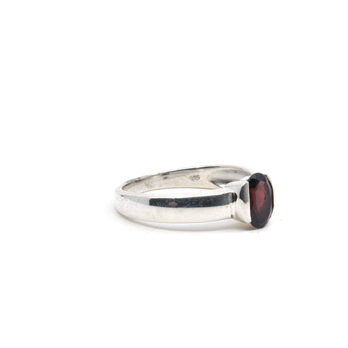 Garnet ring #R421 angled to reveal its polished setting and silver band — Eternal Spirit