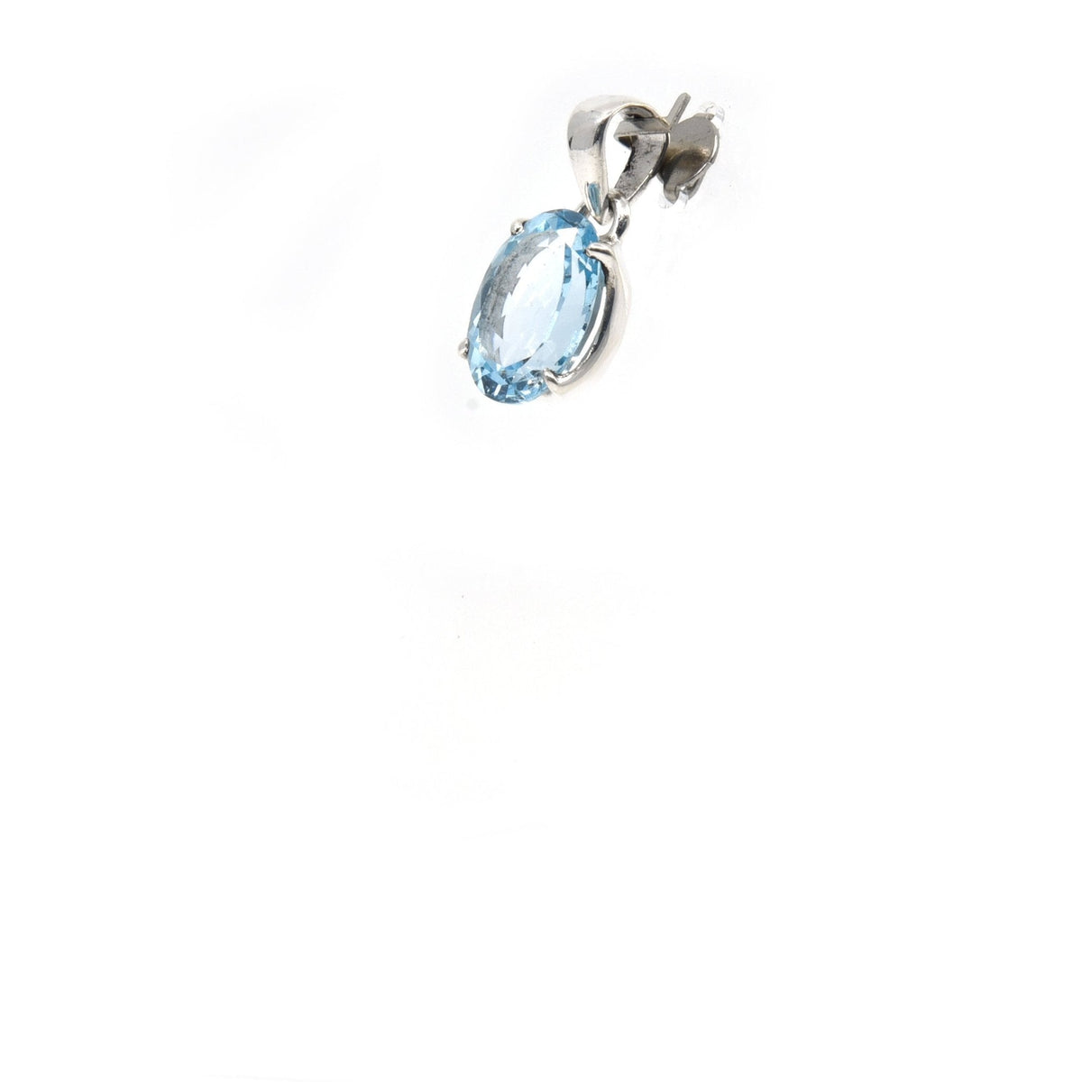 topaz (blue) faceted oval pendant, side view with silver bail and natural stone edge — Eternal Spirit