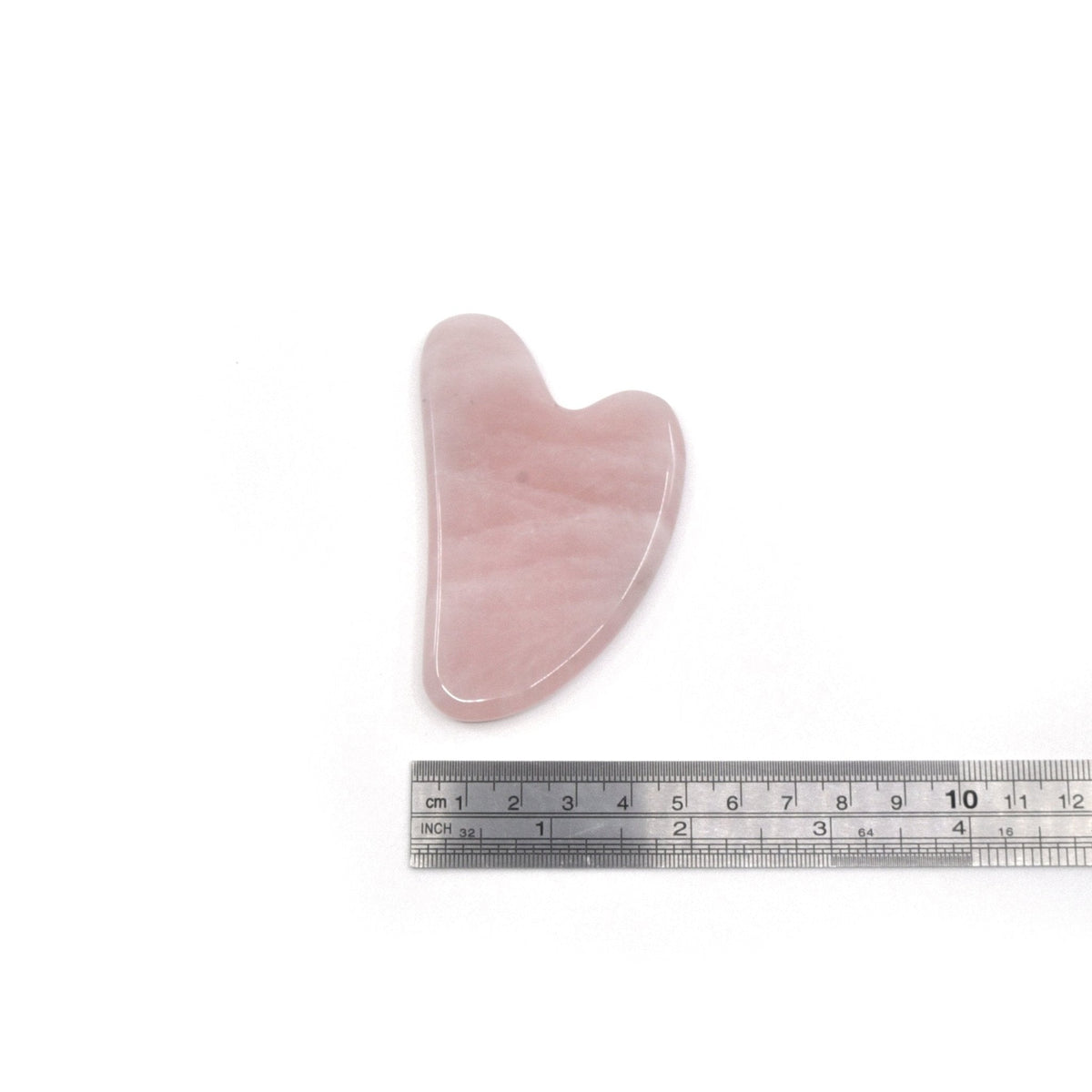 Crystal gua sha in Rose Quartz, held in hand for scale — Eternal Spirit