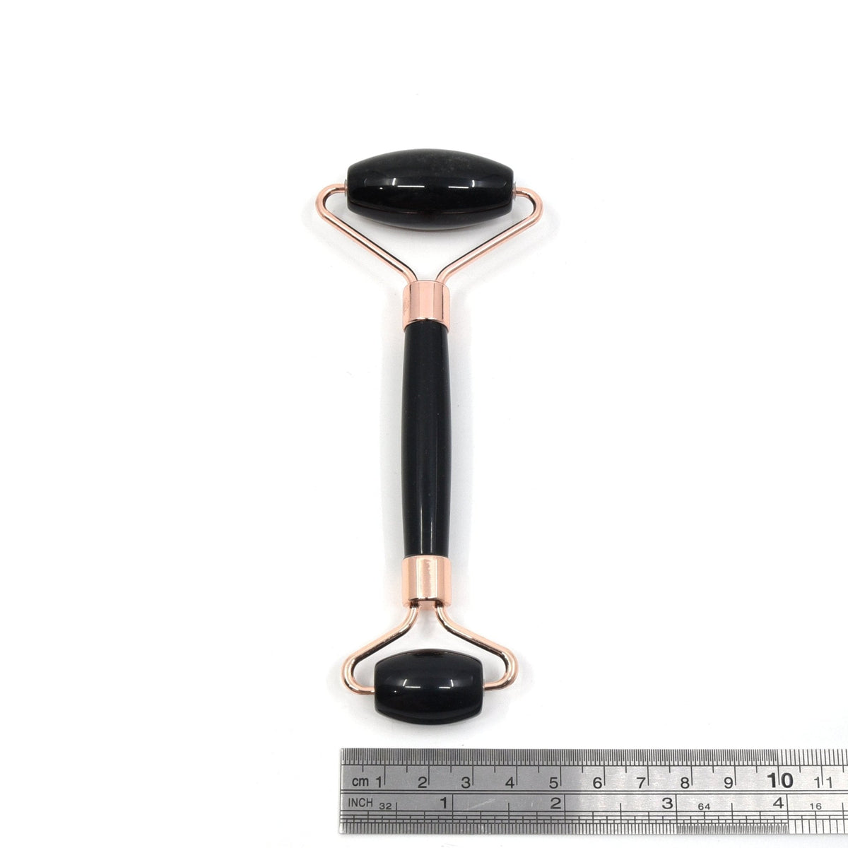 Obsidian roller showing dual massage ends for skincare — Eternal Spirit