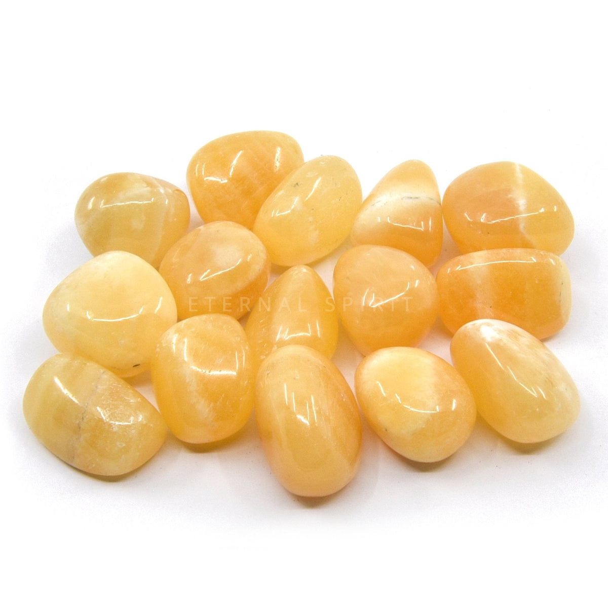 collection of polished Calcite (Orange) tumble stones — Eternal Spirit