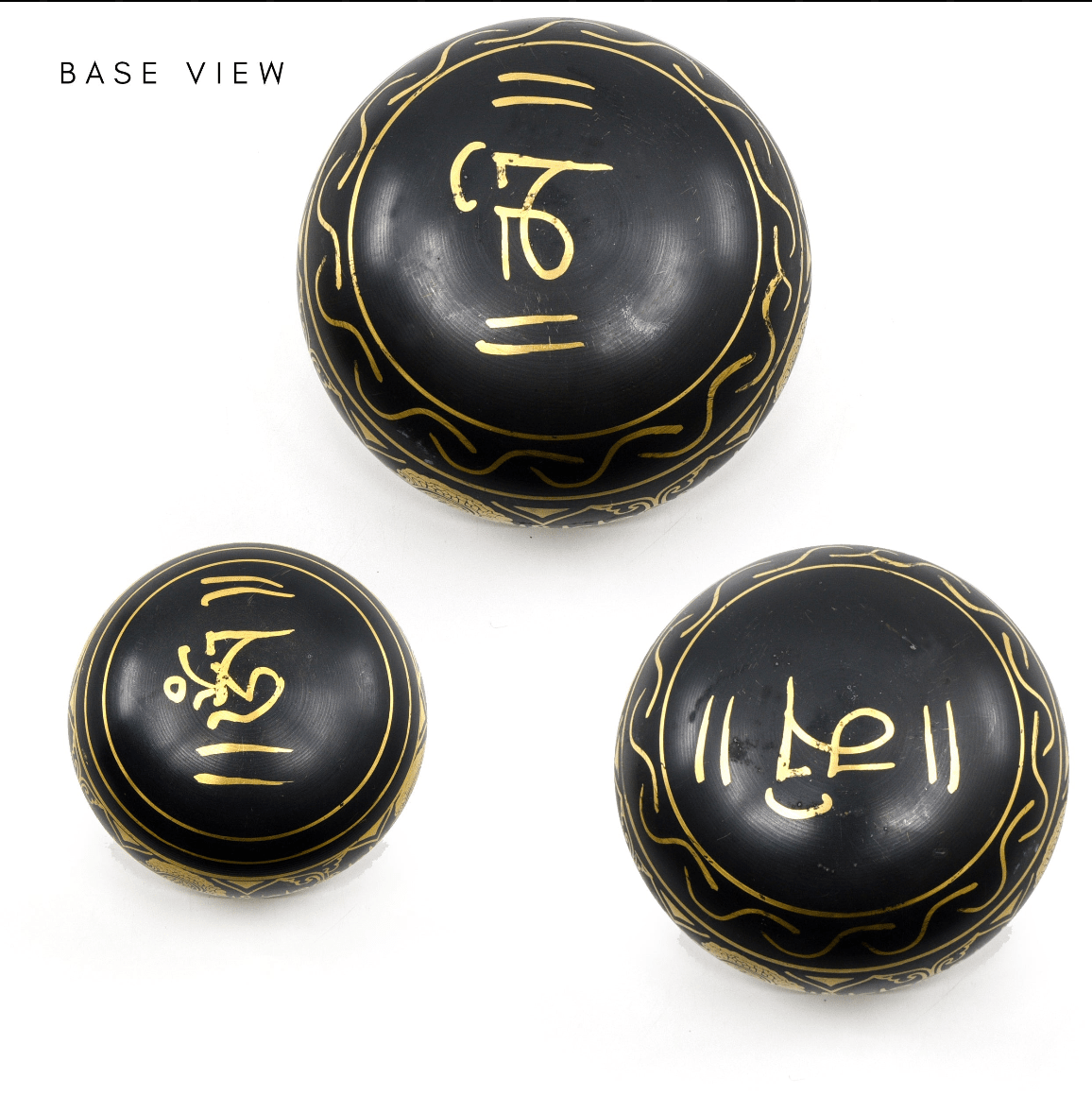 upturned 14.5cm Black & Gold Om Mani Third Eye chakra bowl, mantra-etched base revealed — Eternal Spirit