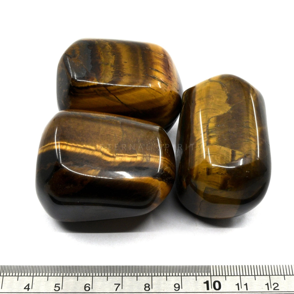 close-up of extra-large Tiger Eye (Yellow) tumbles showing natural colour and lustre — Eternal Spirit