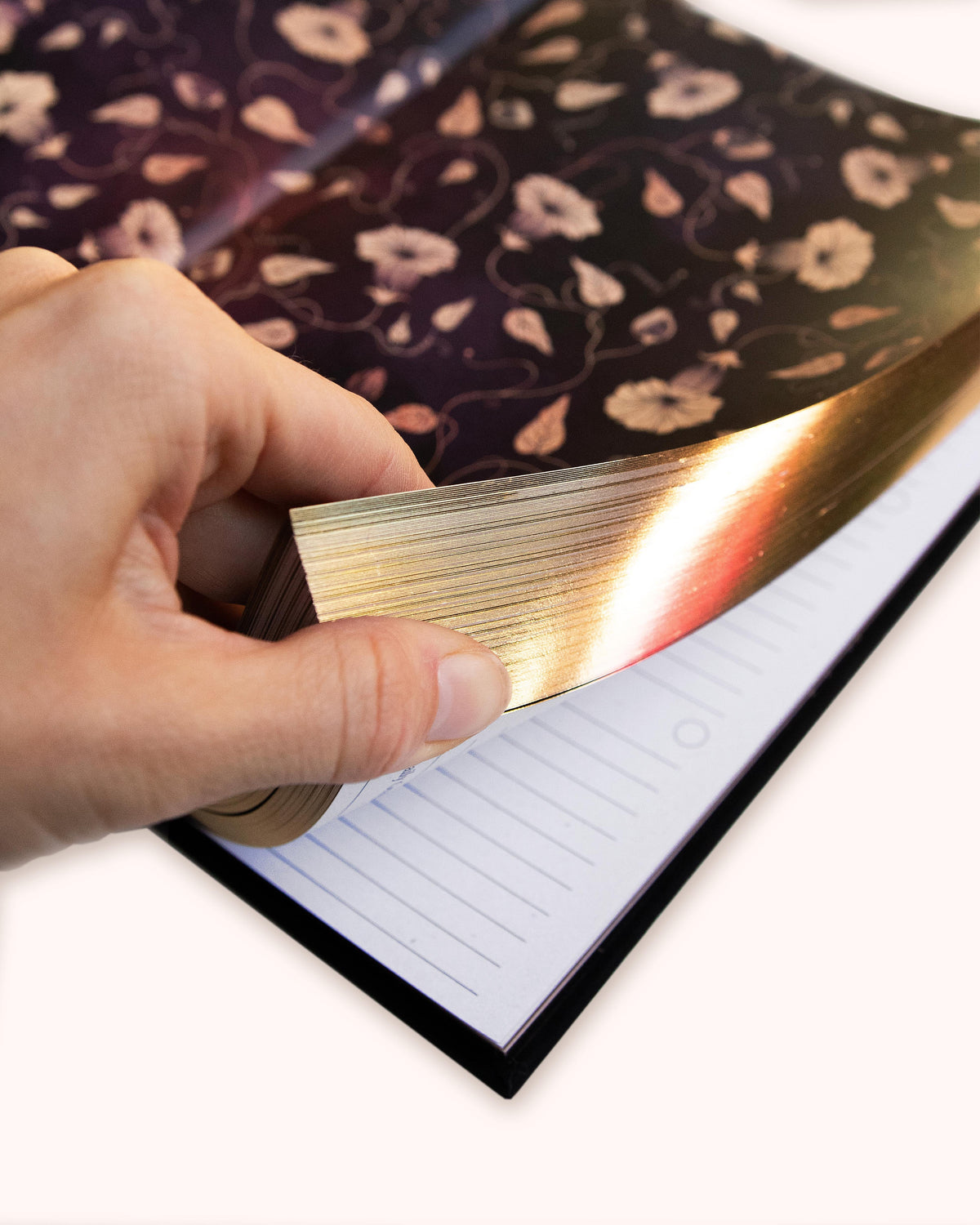 Dreamy Moons diary, hand turning gilded page edges to the lined pages inside — Eternal Spirit