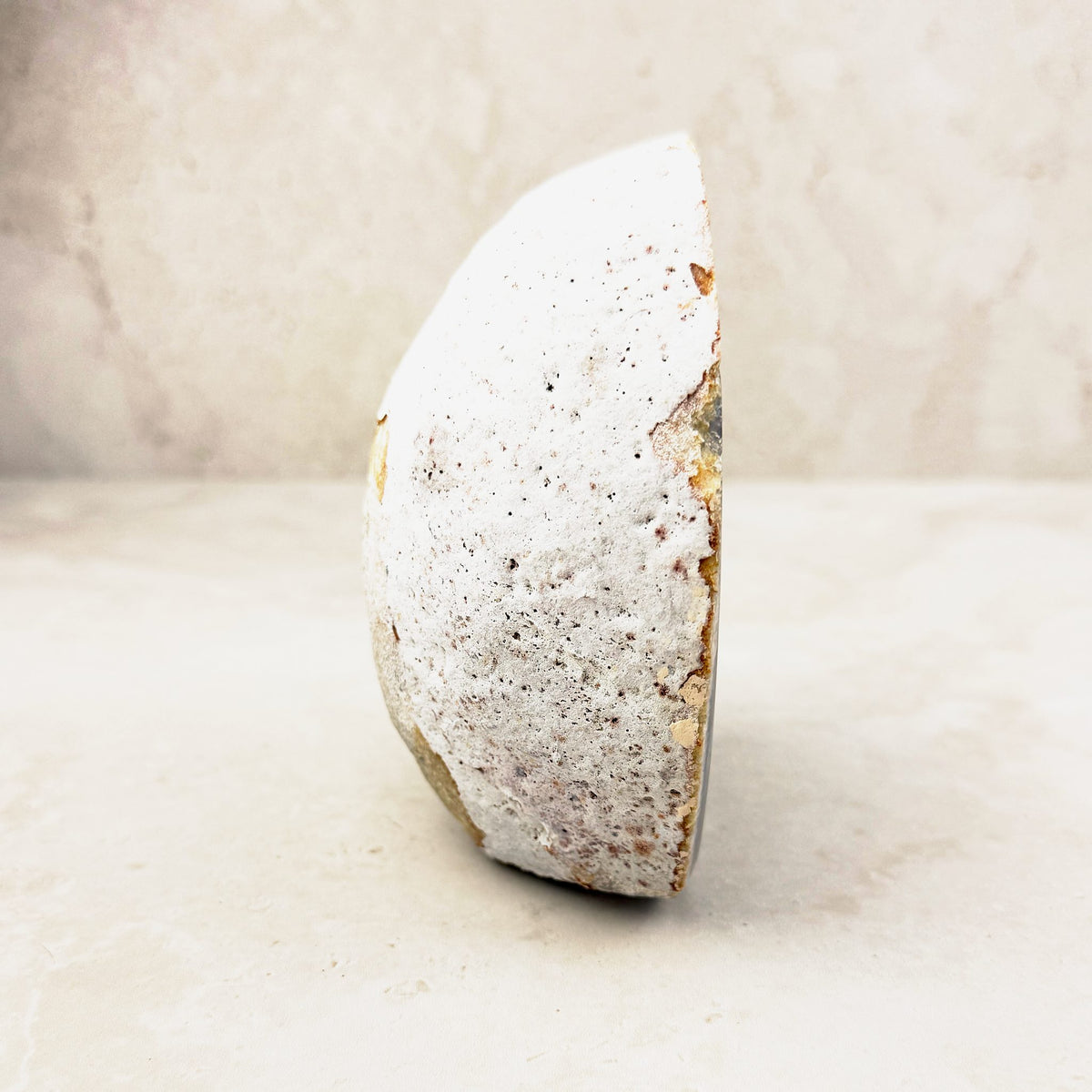 Agate crystal geode 11.5cm, pale speckled outer rind, side view — Eternal Spirit