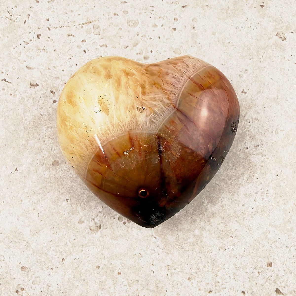 Banded carnelian crystal heart 6cm, cream top shading to chestnut, front view — Eternal Spirit