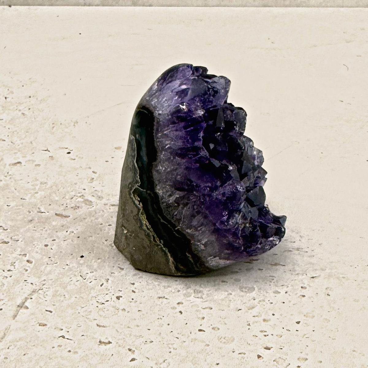 Base cut amethyst crystal 6cm, banded grey shell, side view — Eternal Spirit