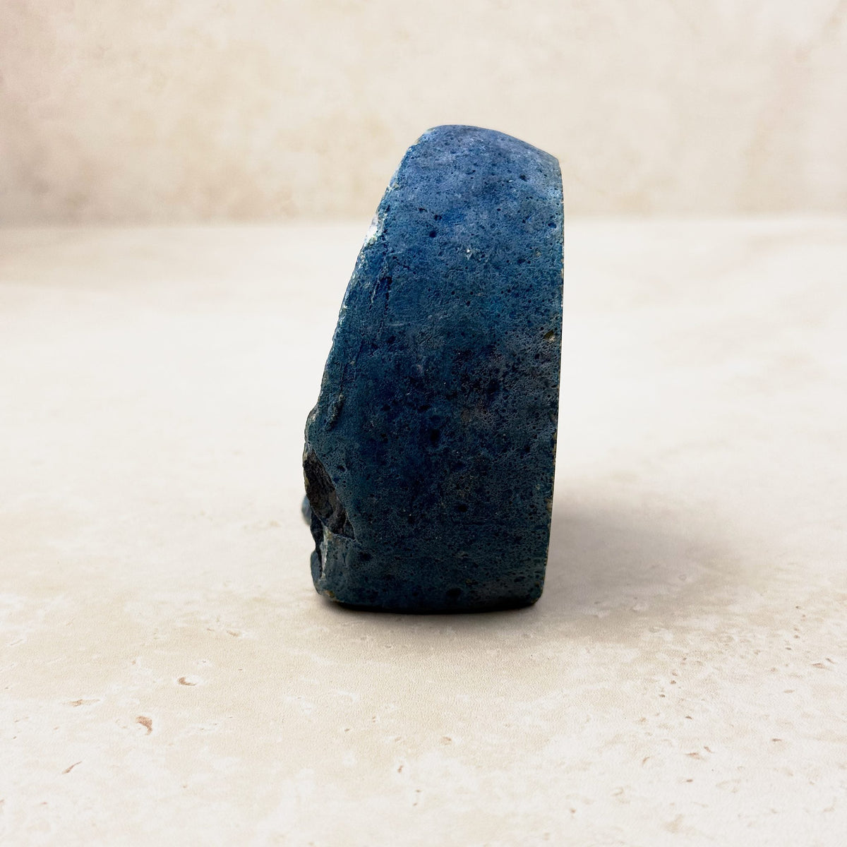 Dyed blue agate crystal geode 7cm, blue textured outer rind, side view — Eternal Spirit