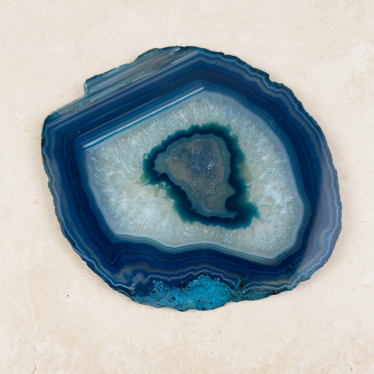 Dyed blue agate crystal slice 14.4cm, teal centre in fine blue bands, viewed from above — Eternal Spirit