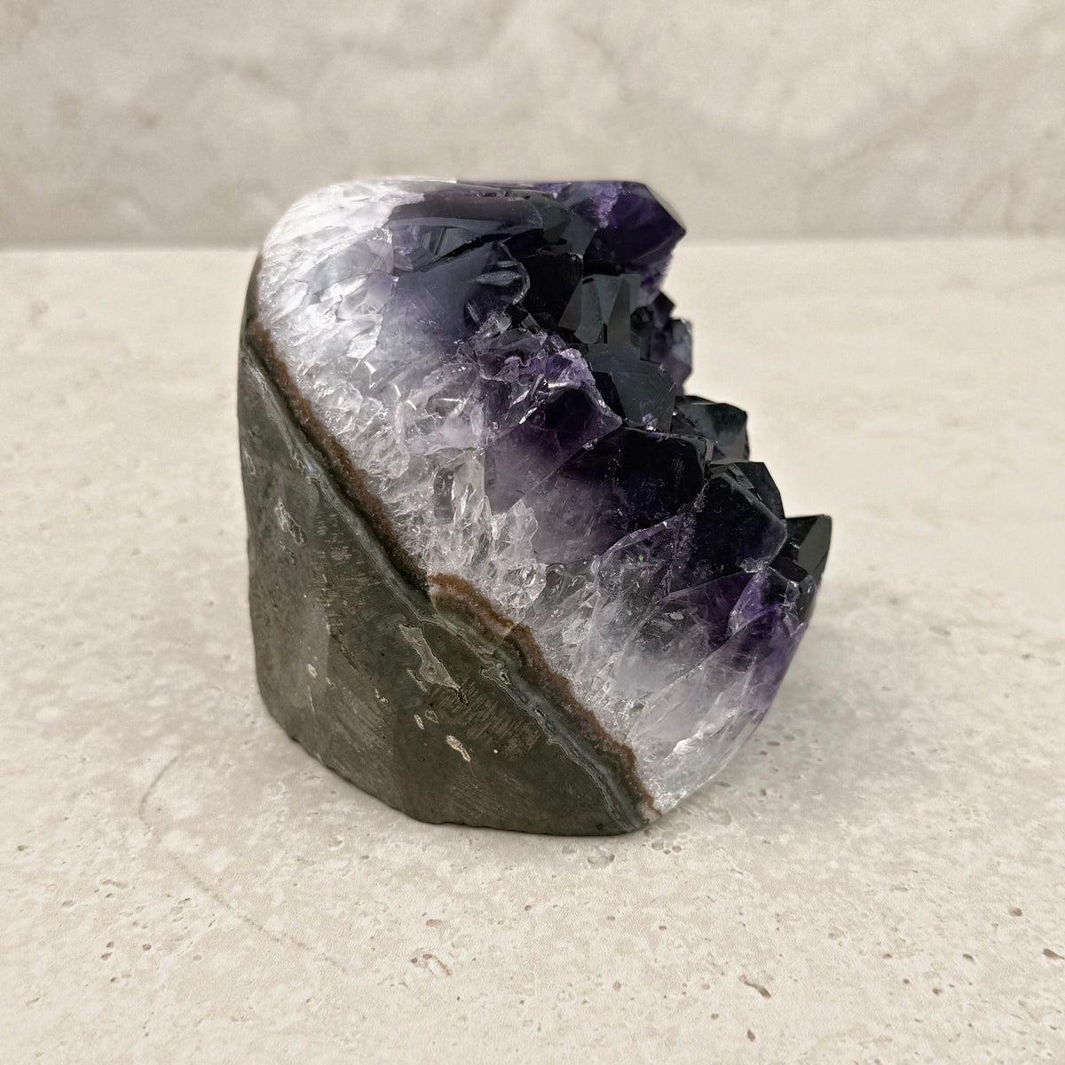Base cut amethyst crystal 10cm, white crystal band beneath the purple, side view — Eternal Spirit