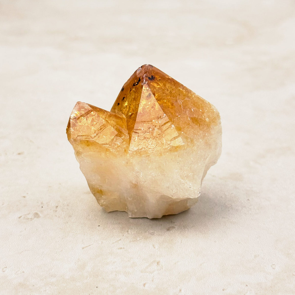 Heated citrine base cut crystal 5cm, amber point over a milky white base, other side — Eternal Spirit
