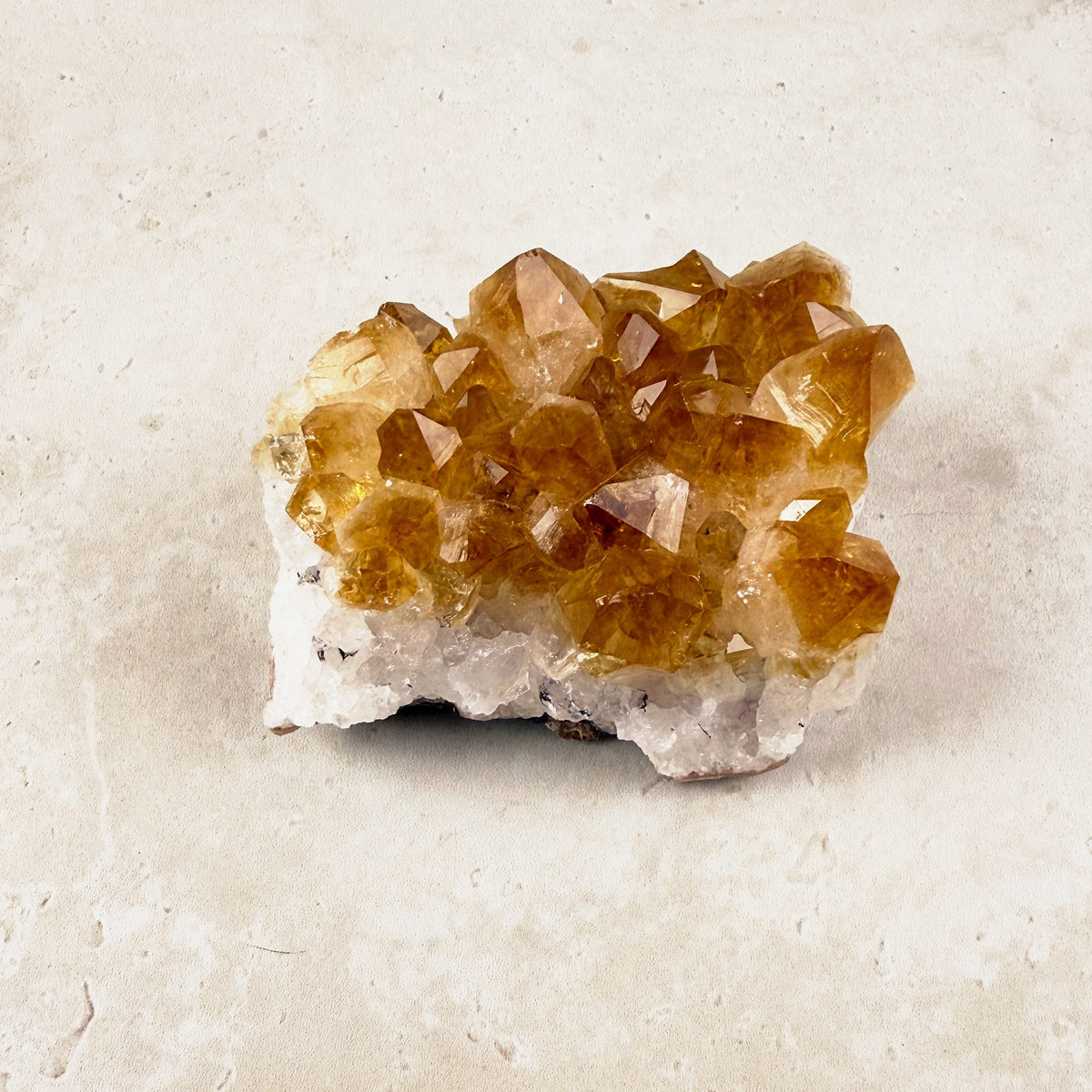 Heated citrine crystal cluster 8.5cm, amber points over a white quartz base, from above at an angle — Eternal Spirit