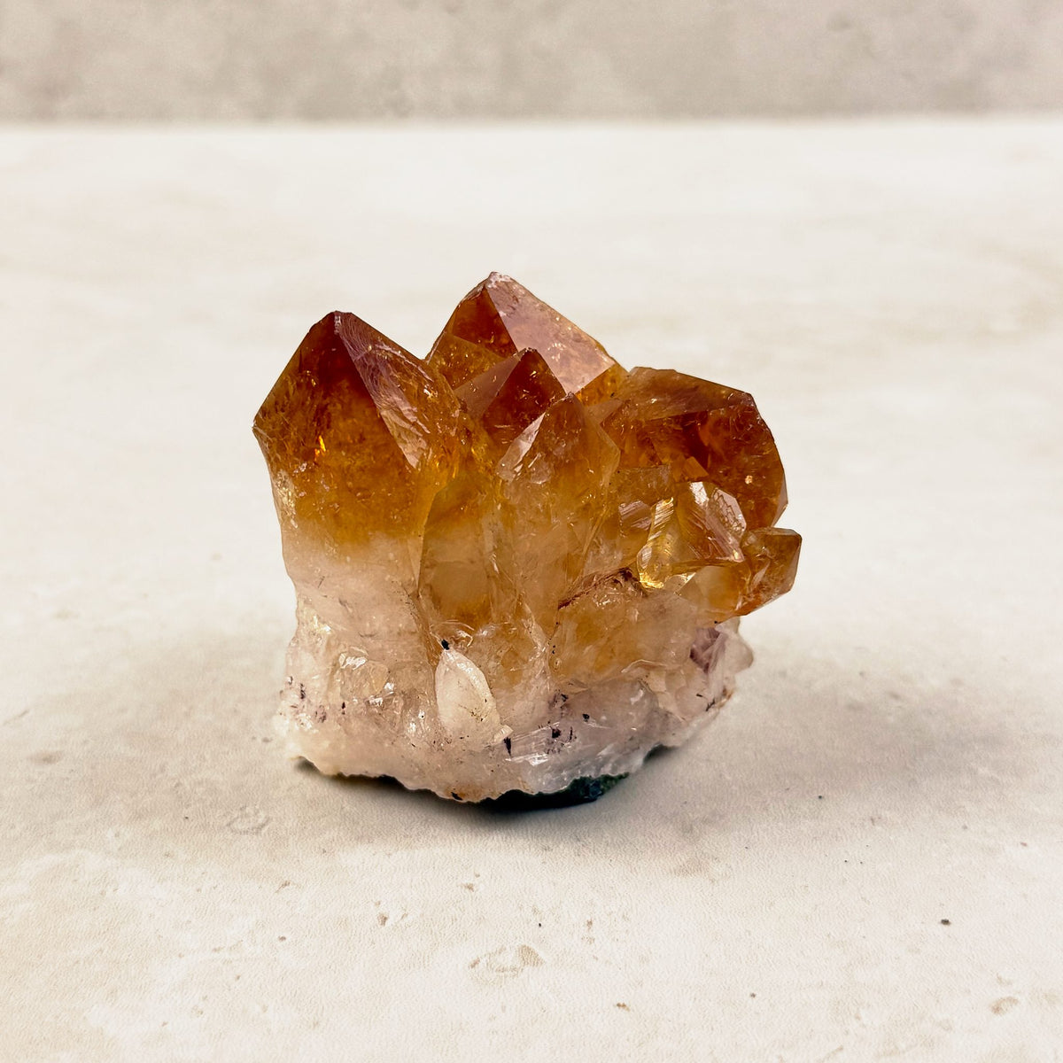 Heated citrine crystal cluster 5.5cm, tall amber points on a pale base, front view — Eternal Spirit