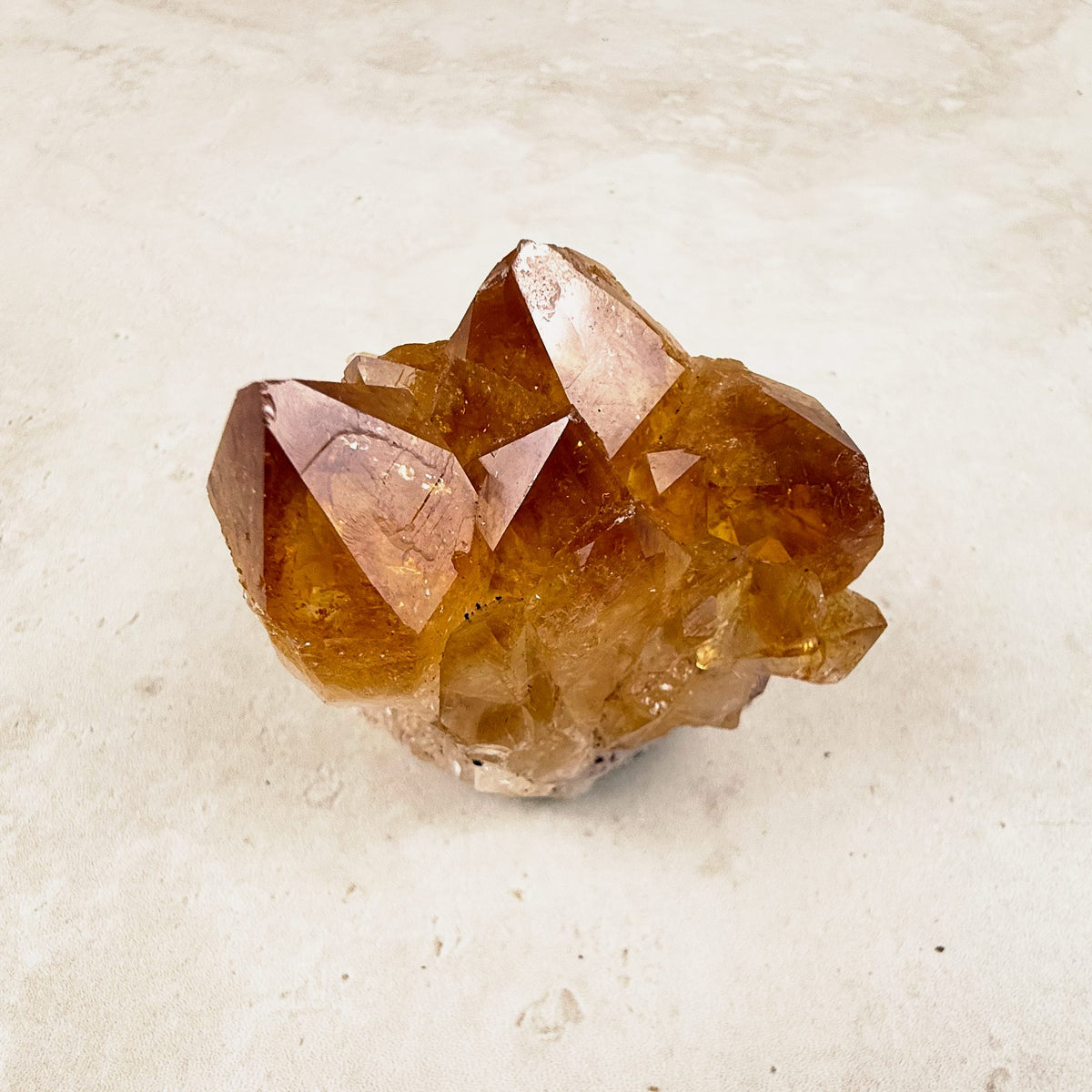 Heated citrine crystal cluster 5.5cm, glossy amber points with sharp tips, angled view — Eternal Spirit