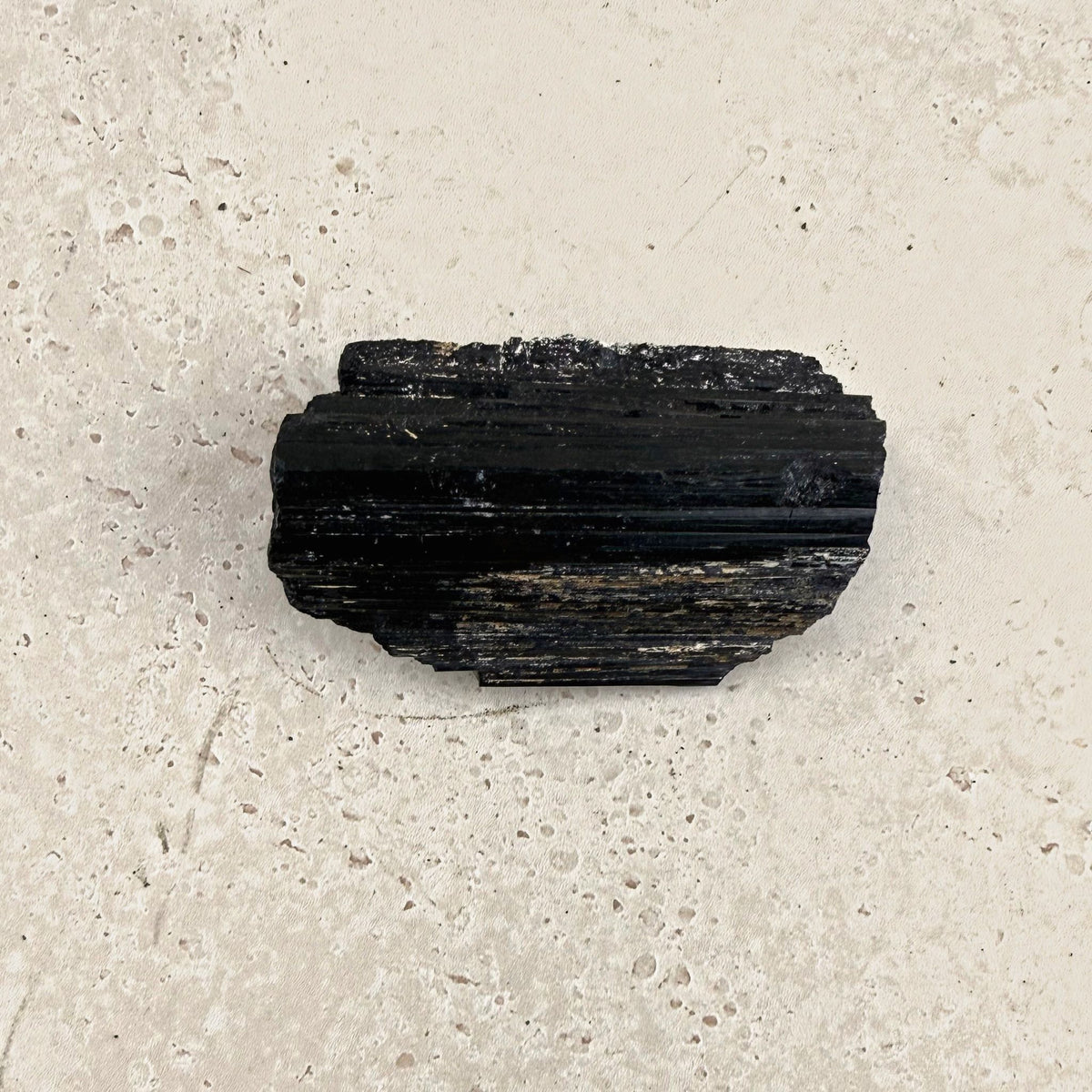 Rough black tourmaline crystal 8.5cm, long rectangular log, front view — Eternal Spirit