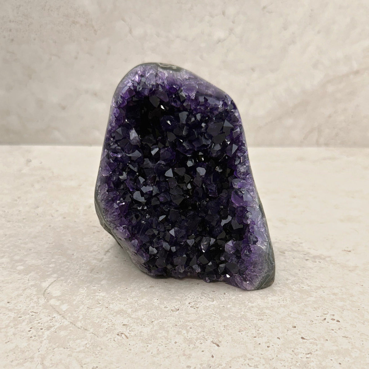 Base cut amethyst crystal 11cm, slanted top of rich purple crystals, front view — Eternal Spirit