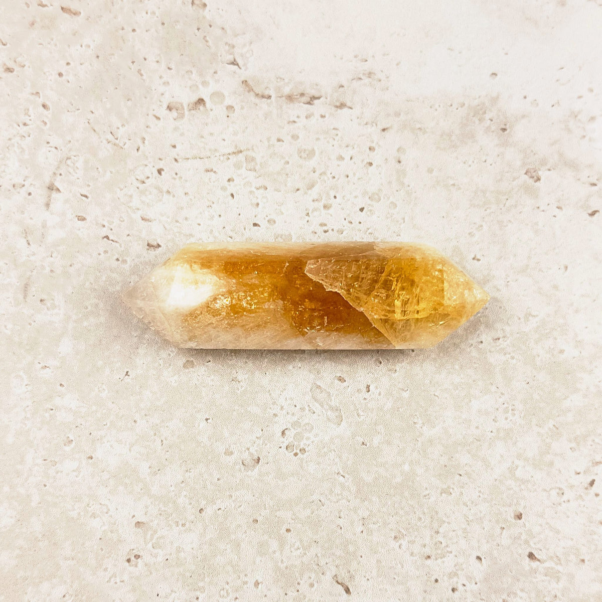 Slender heated citrine crystal wand 8.5cm, amber band through the middle, white tips, side view — Eternal Spirit