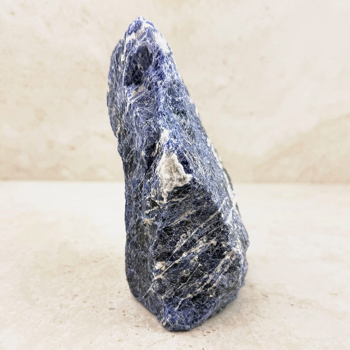Sodalite rough crystal 16cm, tall blue piece with white veining, side view — Eternal Spirit