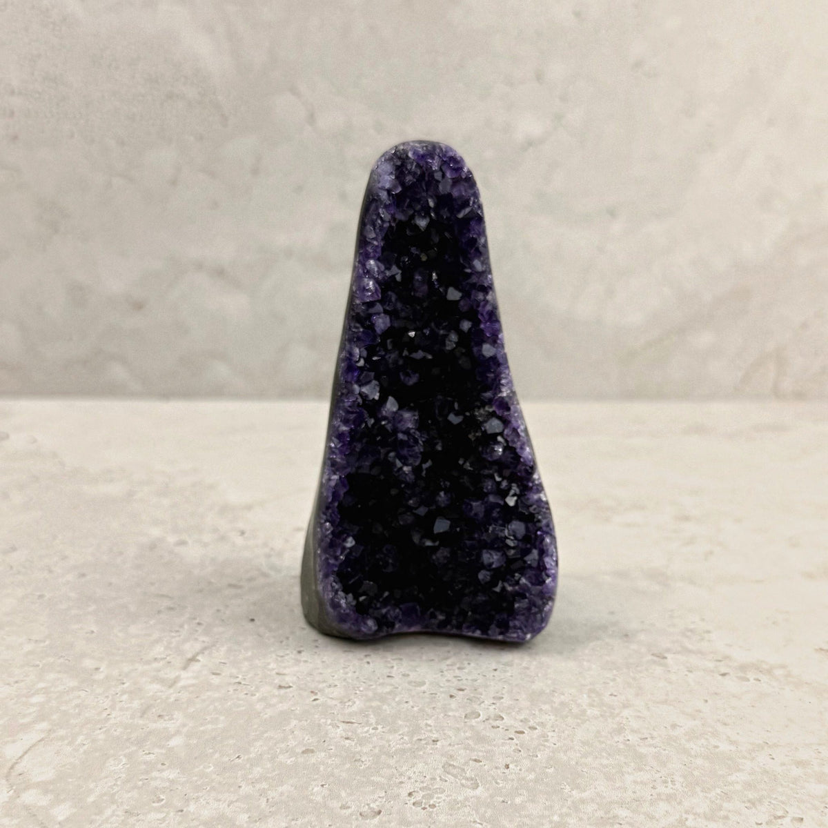 Base cut amethyst crystal 12cm, tall tapered spire of purple crystals, front view — Eternal Spirit