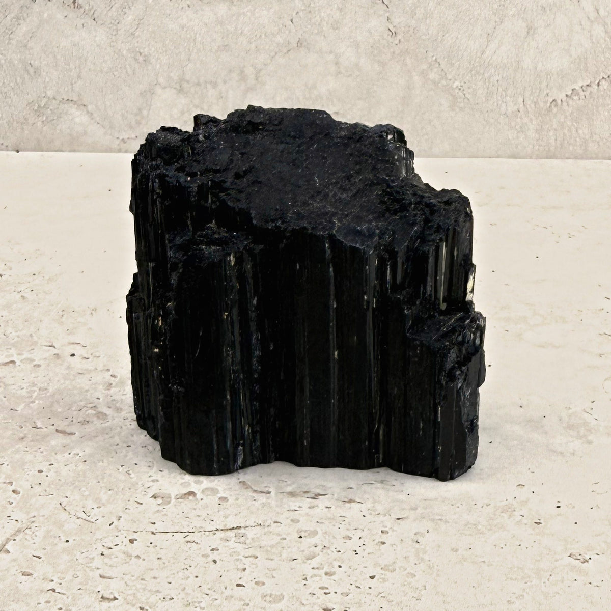 Rough black tourmaline crystal 8cm, chunky stepped block, front view — Eternal Spirit