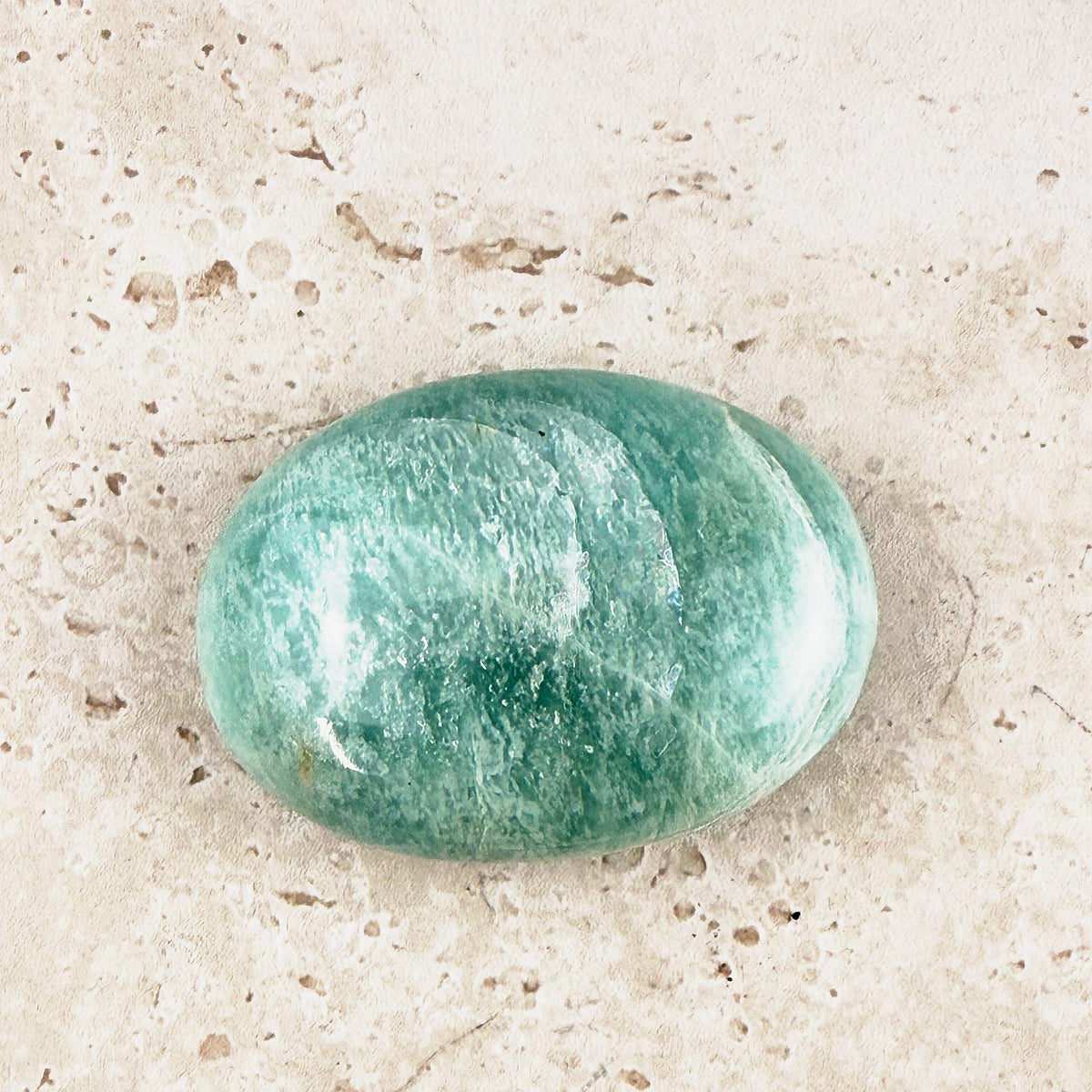 Wide amazonite crystal soap stone 5.5cm, soft teal with white threads, viewed from above — Eternal Spirit