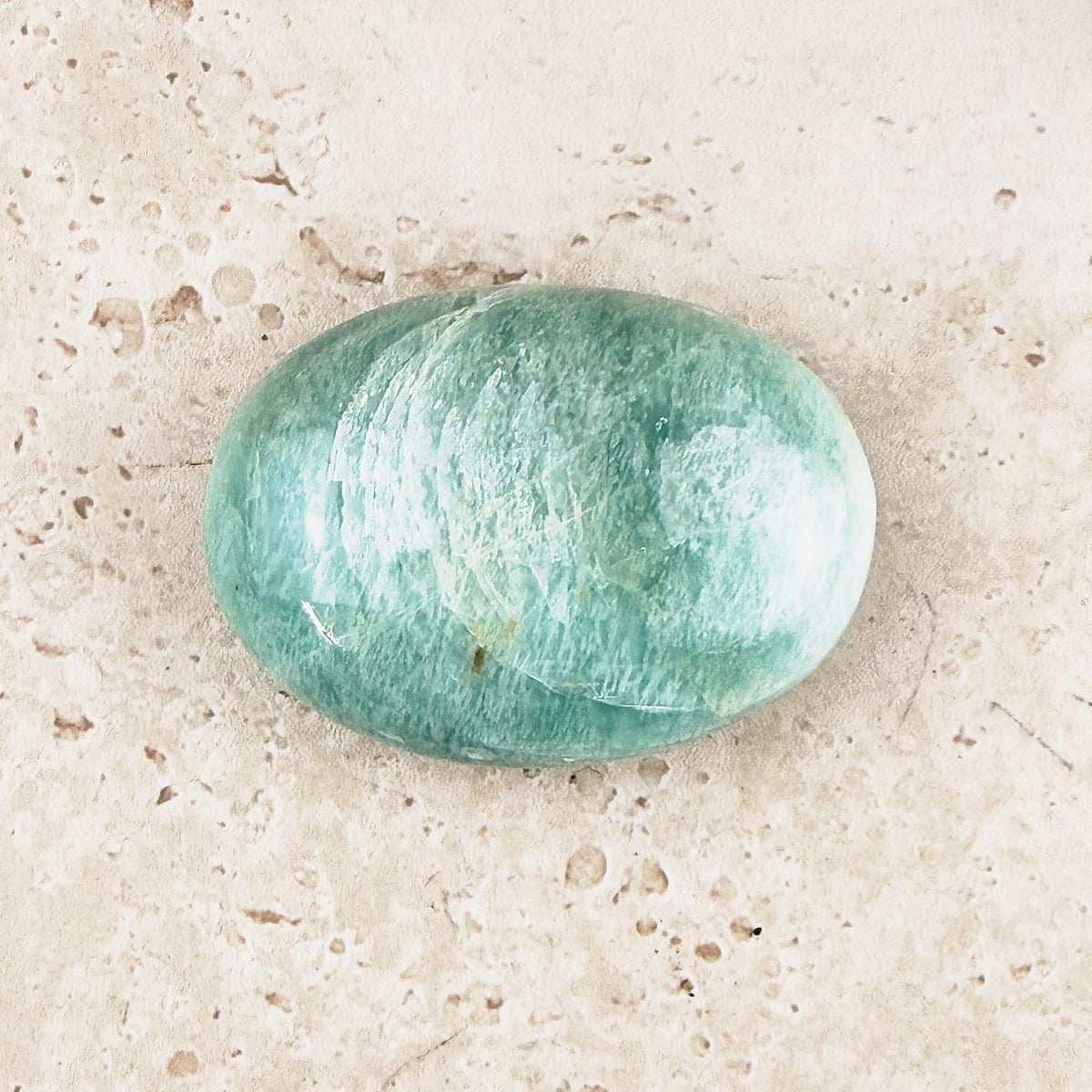 Wide amazonite crystal soap stone 5.5cm, broad teal oval, angled view — Eternal Spirit