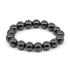 polished Hematite 12mm round bead bracelet on white background — Eternal Spirit