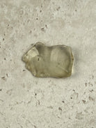 Natural Libyan Desert Glass, a broad flat piece of pale golden impact glass from the Sahara on a stone tile, one of a kind — Eternal Spirit