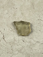 Natural Libyan Desert Glass, a squarish piece of pale golden impact glass from the Sahara on a stone tile, one of a kind — Eternal Spirit