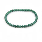 polished Malachite 4mm round bead bracelet on white background — Eternal Spirit