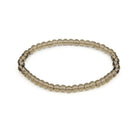 polished Quartz (Smokey) 4mm round bead bracelet on white background — Eternal Spirit