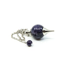 Close-up of Amethyst sphere pendulum, violet stone detail — Eternal Spirit