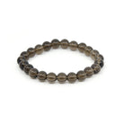 polished Quartz (Smokey) 8mm round bead bracelet on white background — Eternal Spirit