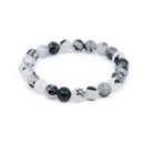 polished Quartz (Tourmalinated) 8mm round bead bracelet on white background — Eternal Spirit