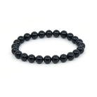 polished Tourmaline (Black) 8mm round bead bracelet on white background — Eternal Spirit