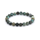 polished Turquoise (African) 8mm round bead bracelet on white background — Eternal Spirit