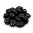 smooth polished Astrophyllite tumble stones on white background — Eternal Spirit